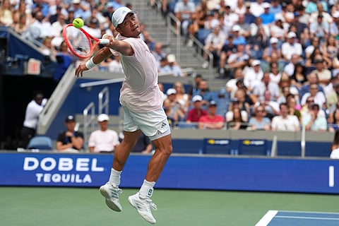 Wu Yibing, of China, returns the ball to Carlos Alcaraz, of Spain, during the third round of the U.S. Open tennis championships in New York.
