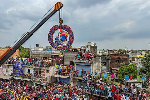 People take part in 'dahi handi' during a 'Janmashtami' celebration, in Ahmedabad, Gujarat.