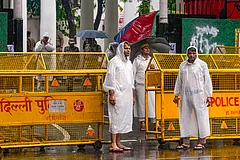 Police personnel stand guard outside Parliament Street police station following the detention of self-styled Hindutva influencer Swatantra Bhardwaj over the alleged assault of Sanjay Kumar, father of CJP protester Nishu Azad, in New Delhi. - | Photo: PTI/Shahbaz Khan