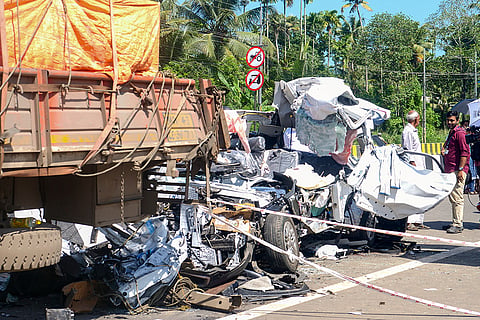 People gather near wreckage of a car after it collided with a lorry parked on the highway at Kaipamangalam, in Thrissur district, Keralam, Saturday, Sept. 5, 2026. Eight engineering students from Tamil Nadu’s Dindigul were killed in the tragic road accident.