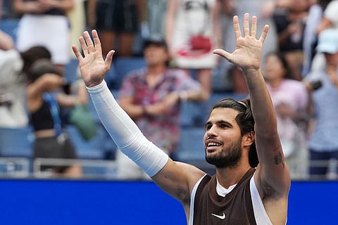 Carlos Alcaraz, of Spain, gestures after he won against Wu Yibing, of China, during the third round of the U.S. Open tennis championships in New York.