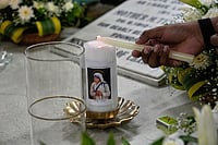 | Photo: AP/Bikas Das : A Catholic lights a candle at the tomb of Saint Teresa on the anniversary of the saint’s death, in Kolkata, India.