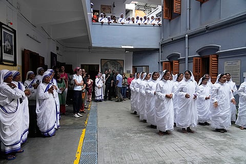 Catholic nuns of the Missionaries of Charity, the order founded by Saint Teresa, and visitors chant 'happy feast day' on the anniversary of the saint’s death, in Kolkata, India.