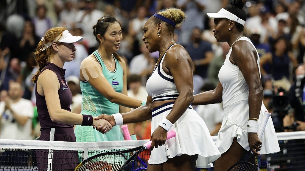 Venus, right, and Serena Williams, of the United States, congratulate Maya Joint, left, of Australia, and Hao-Ching Chan, of Taiwan, after their women's doubles match at the U.S. Open tennis championships. - AP Photo/Adam Hunger