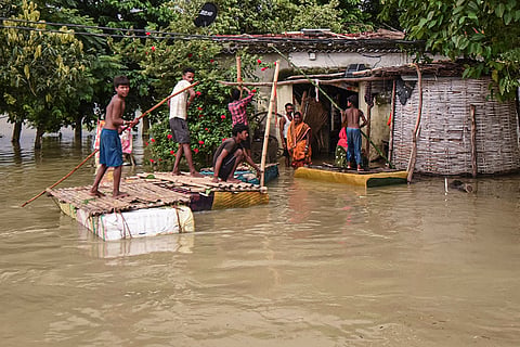 Houses lie partially submerged in floodwaters following a rise in the water level of the Ganga river, at Nakta Diyara, in Patna, Bihar.
