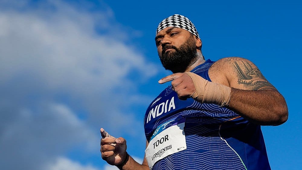 India's Tajinderpal Singh Toor competes in the men's shot put final during the Commonwealth Games 2026, in Glasgow, Scotland. Toor finished fifth with a best throw of 20.27m.  - | Photo: PTI/Ravi Choudhary
