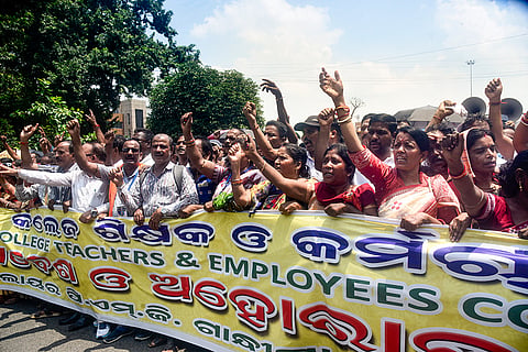 Odisha School College Teachers' and Employees Coordination Committee members stage a demonstration in support of their demands on Teacher’s Day, in Bhubaneswar.