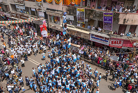 'Govinda Pathaks' form a human pyramid to break the 'Dahi Handi', an earthen pot filled with curd hanging above them, as part of the 'Janmastami' festival celebration, at Dadar, in Mumbai, Saturday, Sept. 5, 2026. 
