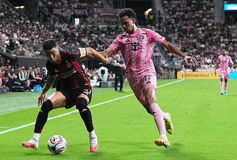 Atlanta United midfielder Miguel Almirón (10) runs with the ball against Inter Miami defender Ian Fray (17) during the first half of an MLS soccer match, Saturday, Sept. 5, 2026, in Miami. 