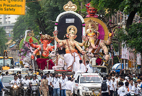 People carry idols of lord Ganesh to 'Pandals' ahead of 'Ganesh Chaturthi' festival, in Mumbai.
