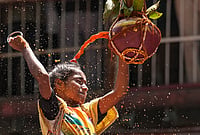 In Photos: Mumbai’s Dahi Handi Celebrations On Janmashtami | Photo: PTI/Kunal Patil : A 'Govinda Pathak' breaks the 'Dahi Handi', an earthen pot filled with curd, as part of the 'Janmastami' festival celebration, at Dadar, in Mumbai, Saturday, Sept. 5, 2026.
