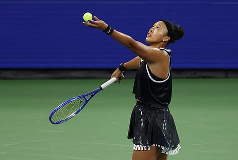 Naomi Osaka, of Japan, tosses the ball to serve to Elise Mertens, of Belgium, during the third round of the U.S. Open tennis championships, Saturday, Sept. 5, 2026, in New York. 