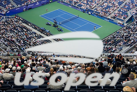 Coco Gauff, of the United States, right, competes against Cristina Bucsa, of Spain, as a U.S. Open tennis logo is reflected during the third round of the championships Saturday, Sept. 5, 2026, in New York. 