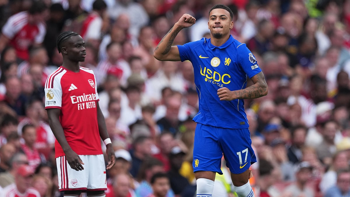 Chelsea's Morgan Rogers celebrates after scoring his side's opening goal during the English Premier League soccer match between Arsenal and Chelsea in London, Sunday, Sept. 6, 2026 - (AP Photo/Dave Shopland)
