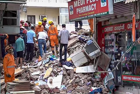 Rescue operation underway after a building collapsed at Satya Niketan area, in New Delhi, Sunday, Sept. 6, 2026. 