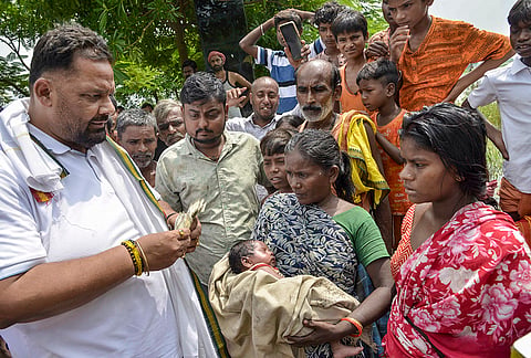 Independent MP Rajesh Ranjan alias Pappu Yadav distributes relief supplies among flood-affected people following a rise in the water level of the Punpun river, in Patna, Bihar, Sunday, Sept. 6, 2026. 