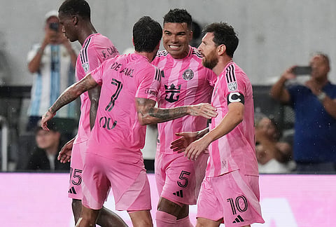 Inter Miami midfielder Casemiro (5) celebrates with midfielder Rodrigo De Paul (7) and forward Leo Messi (10) after scoring a goal during the first half of an MLS soccer match against Atlanta United, Saturday, Sept. 5, 2026, in Miami. 