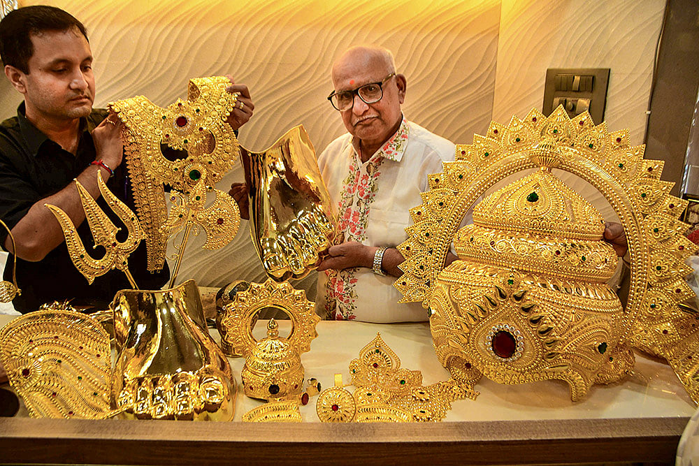 Artisans prepare golden ornaments for Ganesh Chaturthi in Mumbai