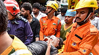 Delhi HC Agrees To Grant Urgent Hearing On PIL Relating To Satya Niketan Building Collapse Incident | Photo: PTI : Delhi Building Collapse LIVE: NDRF, fire department officials carry a rescued person after a 50-year-old five-storey building housing a boys' hostel collapsed in a congested bylane in Satya Niketan near Delhi University’s south campus. Three died in the incident.