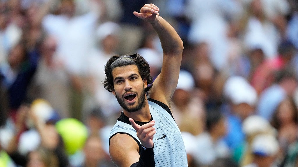 Carlos Alcaraz advanced to the U.S. Open quarterfinals after defeating Tommy Paul in the fourth round. - Yuki Iwamura/AP Photo