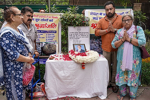 Family members of the victims pay tribute at the Delhi High Court on the 15th anniversary of the September 7, 2011 briefcase bomb blast, in New Delhi.