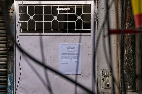 A Municipal Corporation of Delhi (MCD) notice pasted on a door near the site of the building collapse, at Satya Niketan, in New Delhi.