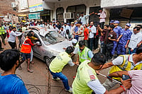 | Photo: PTI/Shahbaz Khan : Delhi Building Collapse: RAF, civil defence, along with residents during a rescue operation after a 50-year-old five-storey building housing a boys' hostel collapsed in a congested bylane in Satya Niketan near Delhi University’s south campus. Three died in the incident.