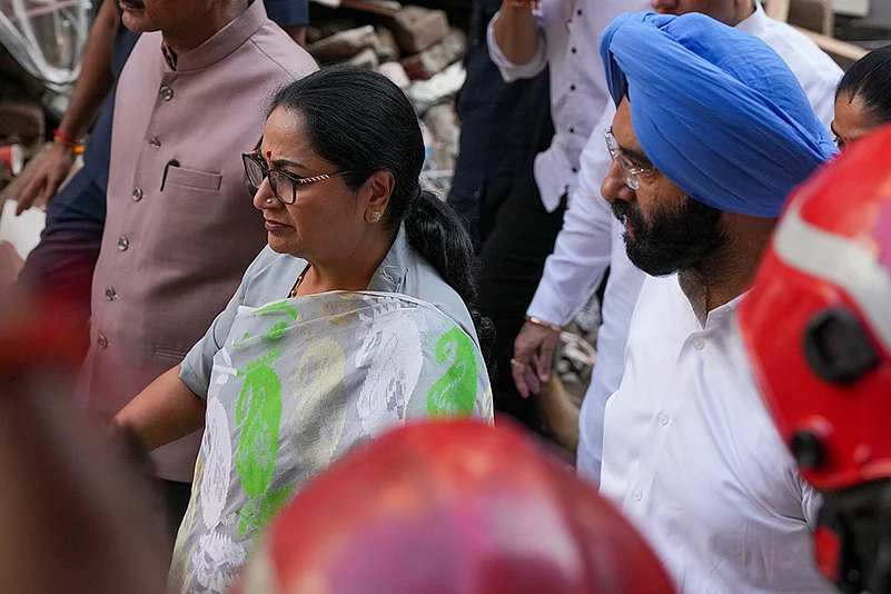 Delhi CM Rekha Gupta at building collapse site