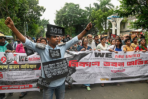 Untainted teachers and non-teaching staff stage a protest march towards the Bikash Bhavan demanding the restoration of their jobs, in Kolkata.