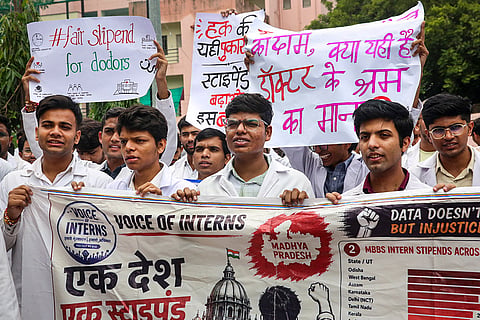 Medical students and MBBS interns hold banners and placards as they take out a rally marching towards the Chief Minister's residence to demand an increase in their monthly stipend, in Bhopal, Madhya Pradesh.
