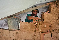 | Photo: AP/Abdel Kareem Hana : Palestinians build a room with mud bricks as an alternative amid a shortage of construction supplies in the Gaza Strip, in Nuseirat, Saturday, Sept. 5, 2026.