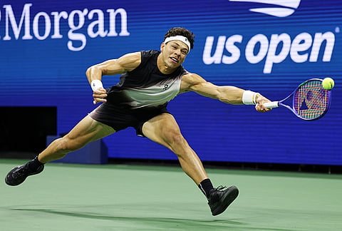 Ben Shelton, of the United States, returns the ball to Stefanos Tsitsipas, of Greece, during the fourth round of the U.S. Open tennis championships, Sunday, Sept. 6, 2026, in New York. 