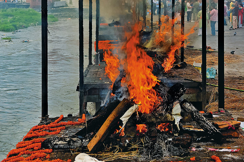 Final Goodbye: The bodies of Nepal flash flood victims are cremated at Arya Ghat inside Kathmandu’s Pashupatinath Temple complex - | Photos: Suresh K. Pandey