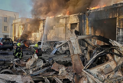Firefighters put out a fire during Russian massive air attack in Kyiv, Ukraine Tuesday, Sept. 8, 2026. 