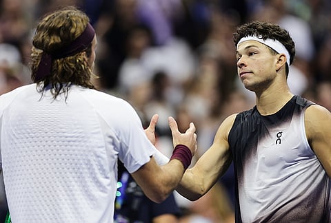Stefanos Tsitsipas, of Greece, left, greets Ben Shelton, of the United States, after Shelton won a match during the fourth round of the U.S. Open tennis championships, Sunday, Sept. 6, 2026, in New York. 