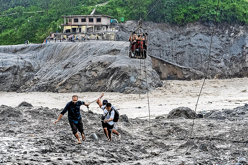 Death and Survival: Rescue workers help people move to safer zones