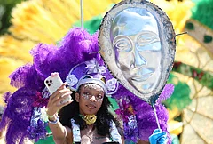 Participants take a selfie as they wait to walk in the West Indian Day Parade on Monday, Sept. 7, 2026, in the Brooklyn borough of New York. - | Photo: AP/Heather Khalifa