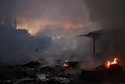 Firefighters try to extinguish a fire following a Russian missile attack in Kyiv, Ukraine, early Tuesday, Sept. 8, 2026. 