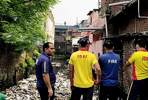 | Photo: PTI : SDRF and Fire services personnel during a rescue operation after two children were allegedly swept away by a strong current in a drain, in Haridwar, Uttarakhand.