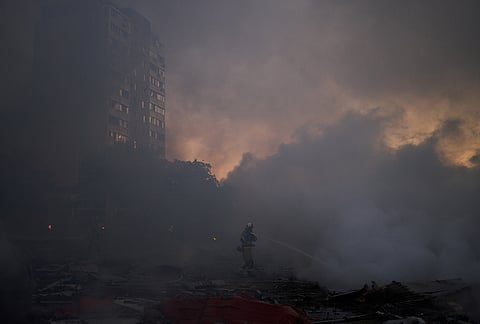 Firefighters try to extinguish a fire following a Russian missile attack in Kyiv, Ukraine, early Tuesday, Sept. 8, 2026. 