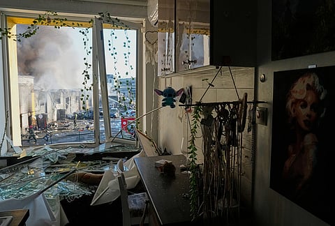 Firefighters work on the site of a burning building after a Russian missile attack in Kyiv, Ukraine, Tuesday, Sept. 8, 2026. 