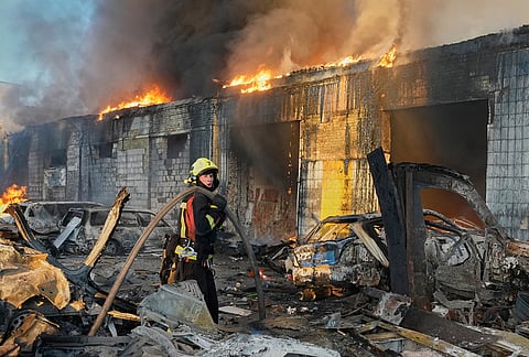 Firefighters put out a fire during Russian massive air attack in Kyiv, Ukraine Tuesday, Sept. 8, 2026. 