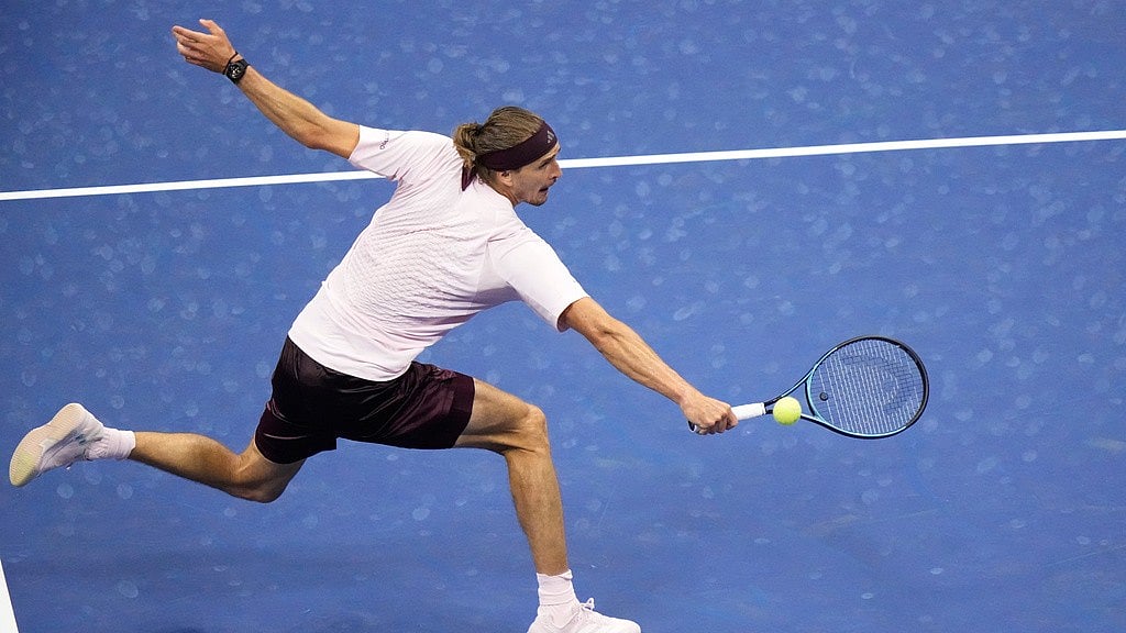 Alexander Zverev, of Germany, returns the ball to Luciano Darderi, of Italy, during the fourth round of the U.S. Open tennis championships Monday. - Frank Franklin II/AP Photo