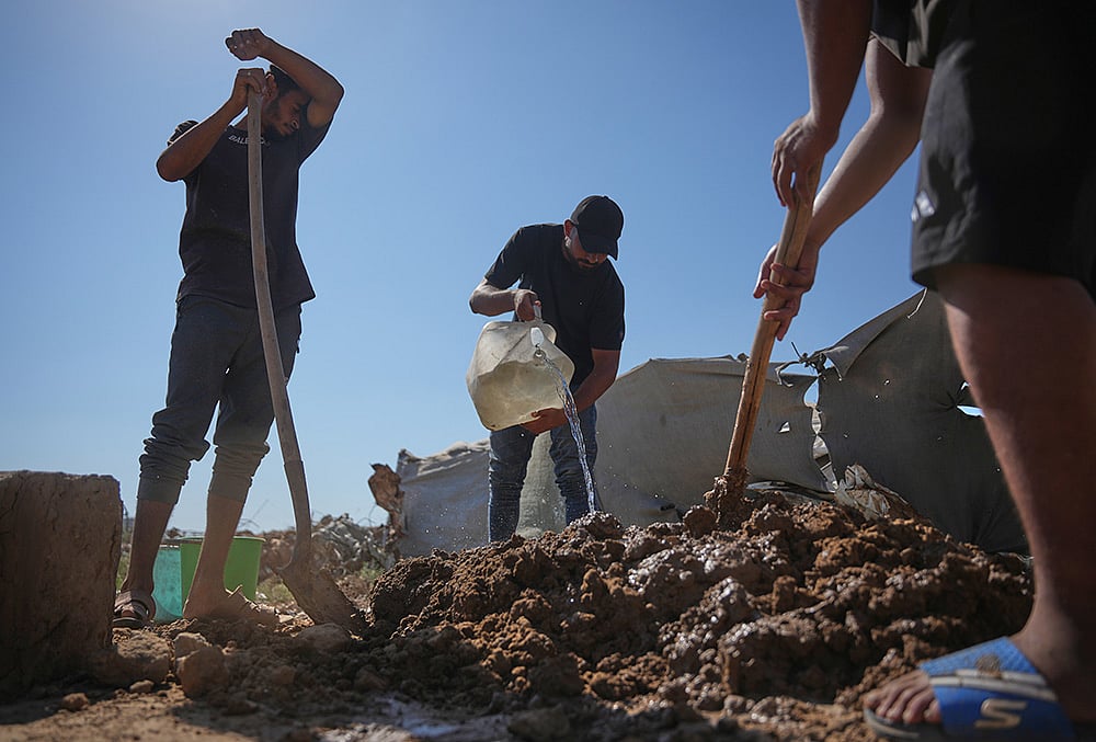 Palestinians building with mud bricks