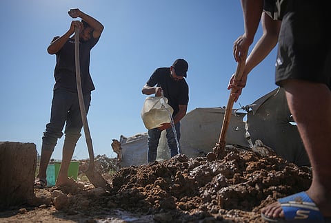 Palestinians make clay bricks for building amid a shortage of construction materials in the Gaza Strip, in the Maghazi refugee camp, central Gaza Strip, Thursday, Sept. 3, 2026. 