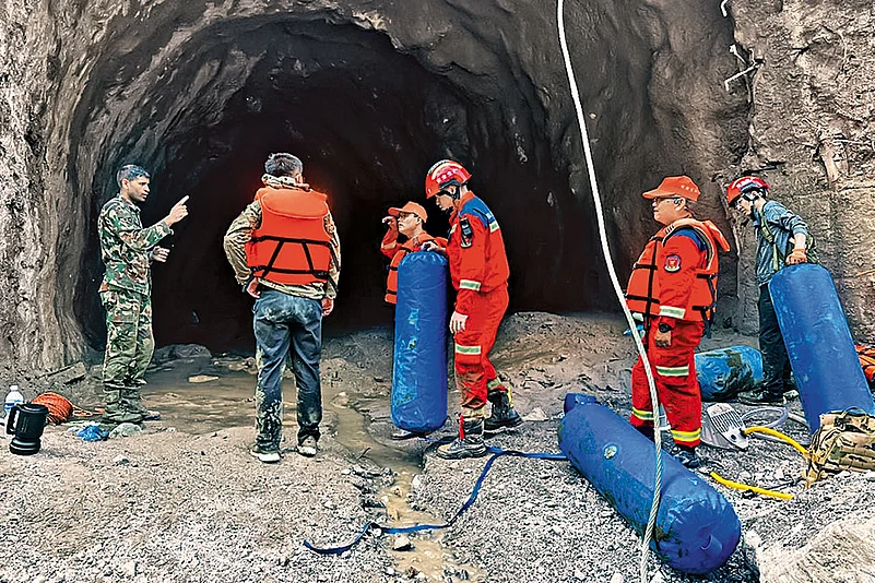 Nepali soldiers undertake a rescue operation at a hydropower project in Upper Trishuli, Nepal.
