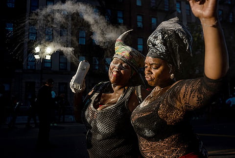 People participate in J'Ouvert festivities ahead of the West Indian Day Parade at sunrise on Labor Day in the Crown Heights and Flatbush neighborhoods of Brooklyn, Monday, Sept. 7, 2026, in New York. 