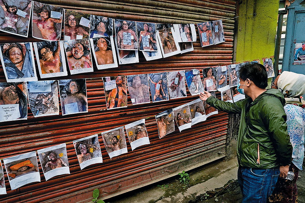 A man searches the notice board at Maharajgunj Hospital in Kathmandu for his missing loved one