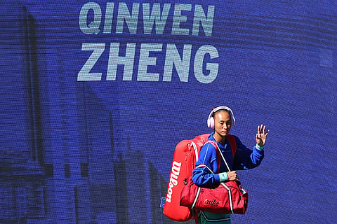 Qinwen Zheng, of China, arrives for a match against Iga Swiatek, of Poland, during the fourth round of the U.S. Open tennis championships in New York.