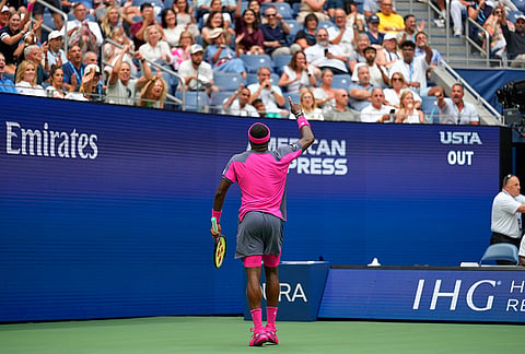 Frances Tiafoe, of the United States, points to the crowd during a match against Alex Michelsen, of the United States, during the quarterfinal round of the U.S. Open tennis championships, Tuesday, Sept. 8, 2026, in New York. 